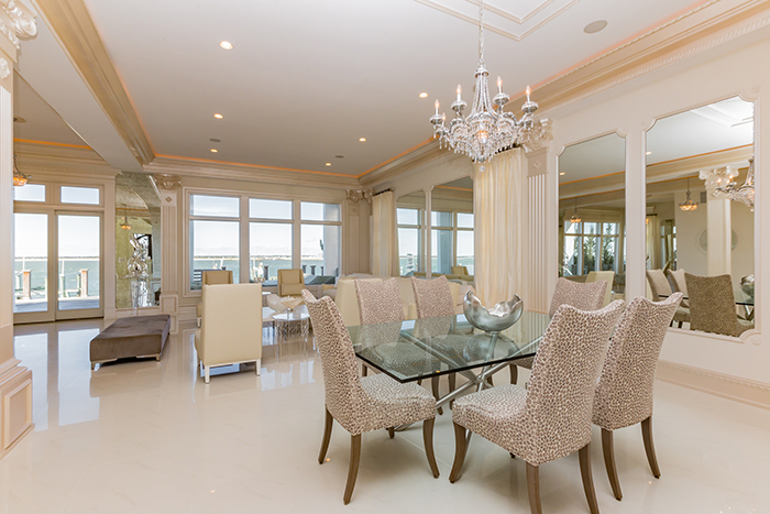 This extraordinary, custom-built, bayfront home combines architectural splendor & casual elegance. A magnificent grand staircase leads to the master suite with hand selected marble flooring and a private deck to view gorgeous sunsets.