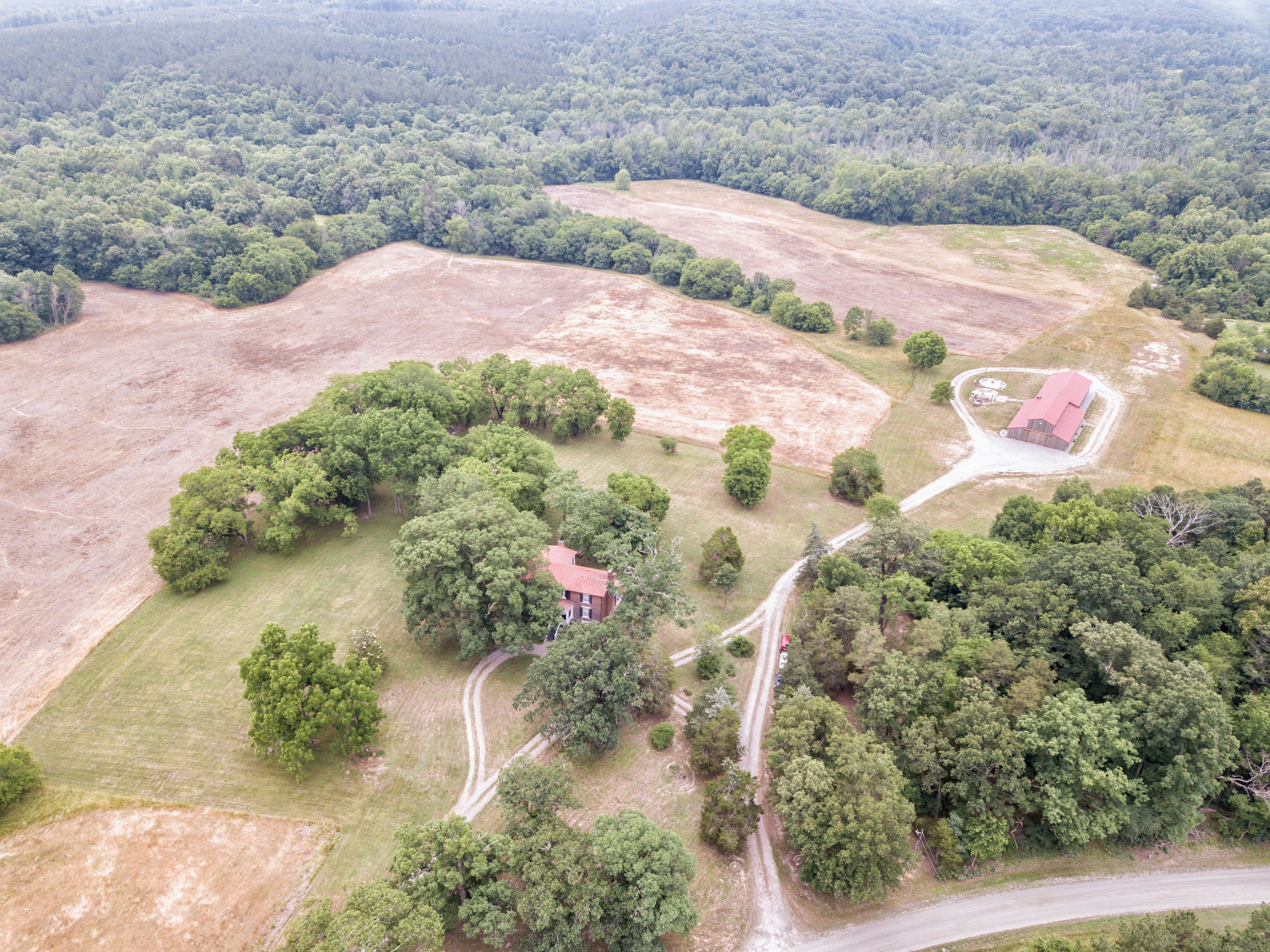 Aerial view of property with barn