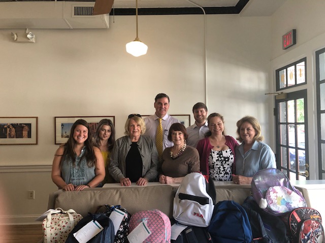 Members of the Strawberry Street office participate in the bookbag drive