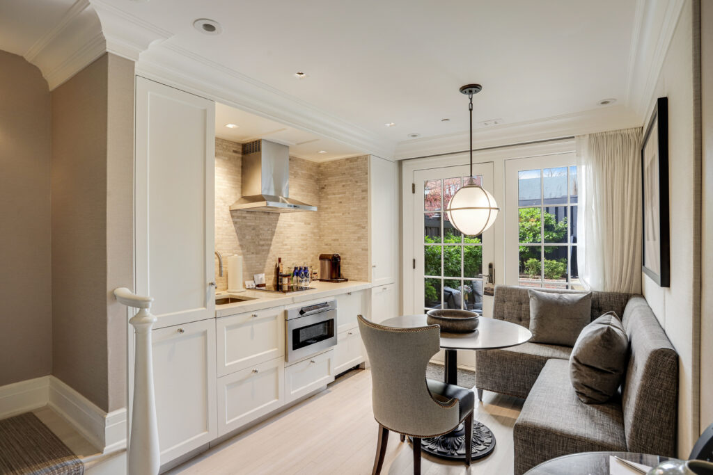 The fully equipped kitchen is outfitted with premium appliances from SMEG, Williams Sonoma, KitchenAid, and Nespresso.