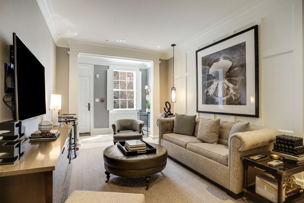 Living spaces feature a neutral color palette, custom furnishings, and a curated art collection celebrating local artists complete the design.
