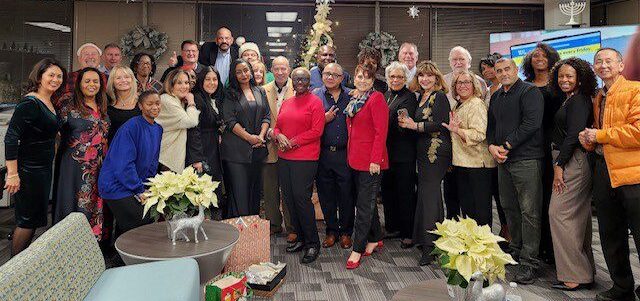 The Greater Silver Spring office gathers together for their annual holiday party in 2024.