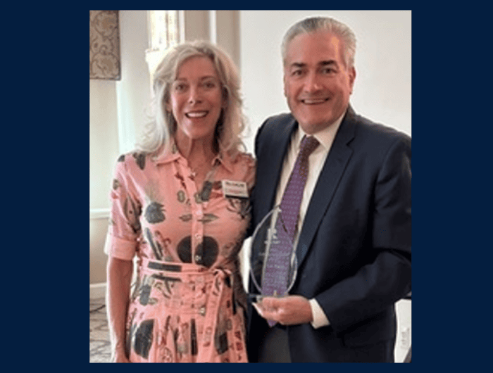 Pictured here, Pam Batstone, president of the Anne Arundel County Association of Realtors' Board, presents Dan Early with the Lifetime Achievement Award.